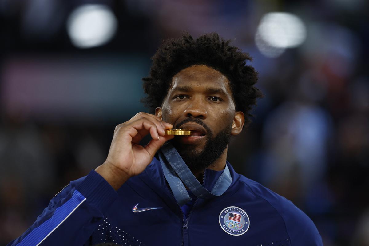 Joel Embiid celebrates winning the hold medal for the United States at the Paris 2024 Olympics.