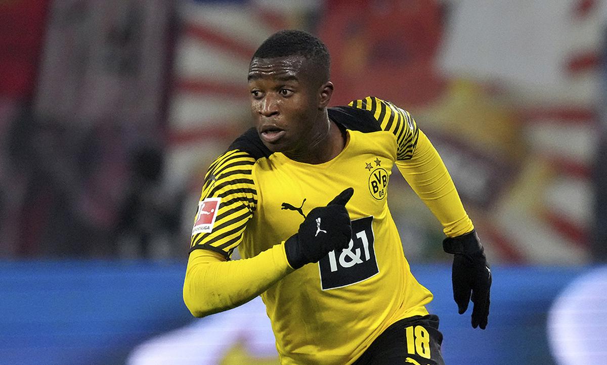 FILE -- Dortmund’s Youssoufa Moukoko runs during the German Bundesliga soccer match between RB Leipzig and Borussia Dortmund in Leipzig, Germany, Saturday, Nov. 6, 2021. 