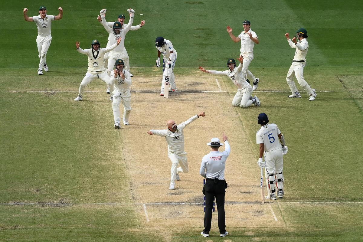 Nathan Lyon celebrates after trapping Mohammed Siraj lbw. 