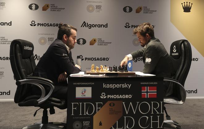 Magnus Carlsen, right, in action against Ian Nepomniachtchi of Russia, during the FIDE World Championship.
