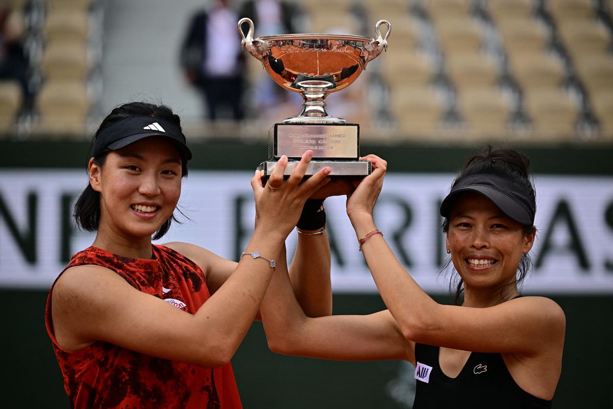 China’s Wang Xinyu (left) and Chinese Taipei’s Hsieh Su-wei (right) with the Simonne-Mathieu Cup after winning the women’s doubles title at French Open in 2023.