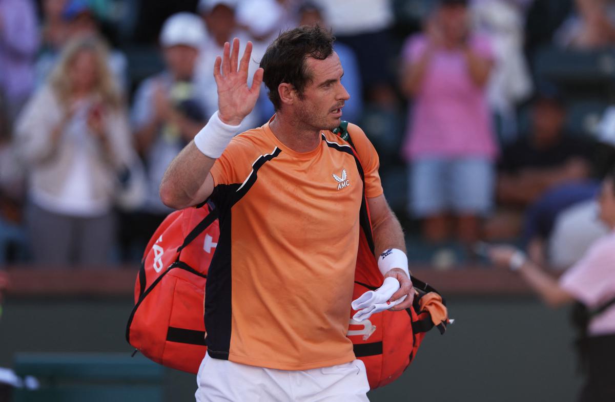 Andy Murray walks off court dejected after his straight sets defeat against Andrey Rublev. 