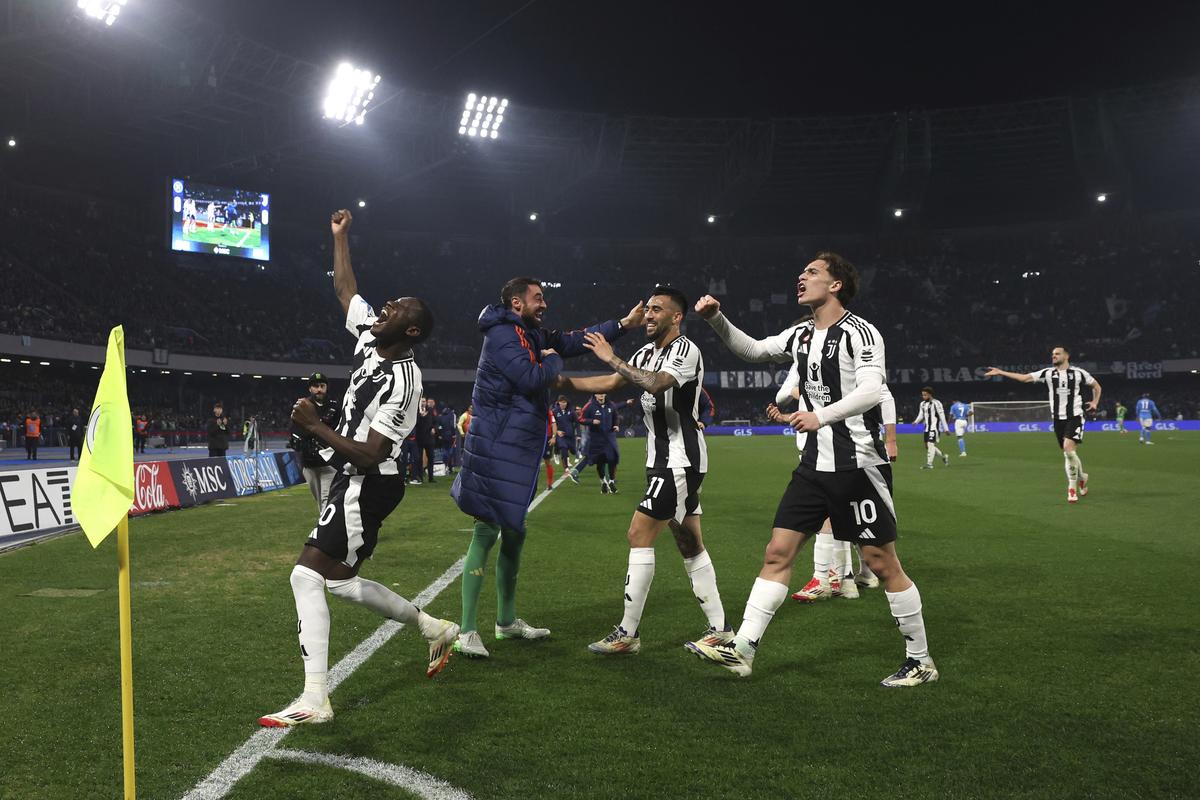 Juventus’ Randal Kolo Muani, left, celebrates after scoring the team’s first goal during the Serie A match between Napoli and Juventus at the Diego Armando Maradona Stadium in Naples, Italy, Saturday Jan. 25, 2025.