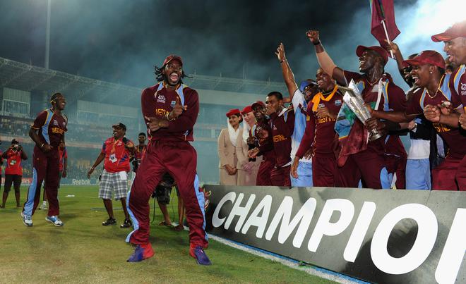 Chris Gayle celebrates with teammates after West Indies won its first T20 World Cup title in 2012, beating Sri Lanka in the final. 
