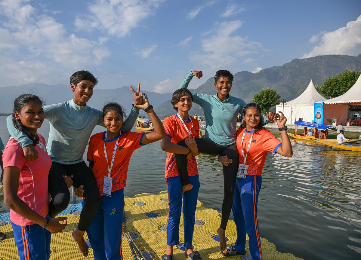 Niharika (left, blue) and Chandrakala (the other blue) with other teammates]