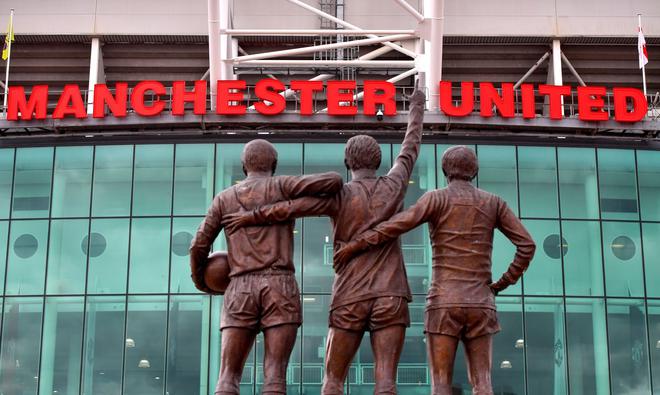 The Unity Trinity statue, depicting footballers George Best, Denis Law and Bobby Charlton, outside the Old Trafford football ground and the intended destination for the protest march.