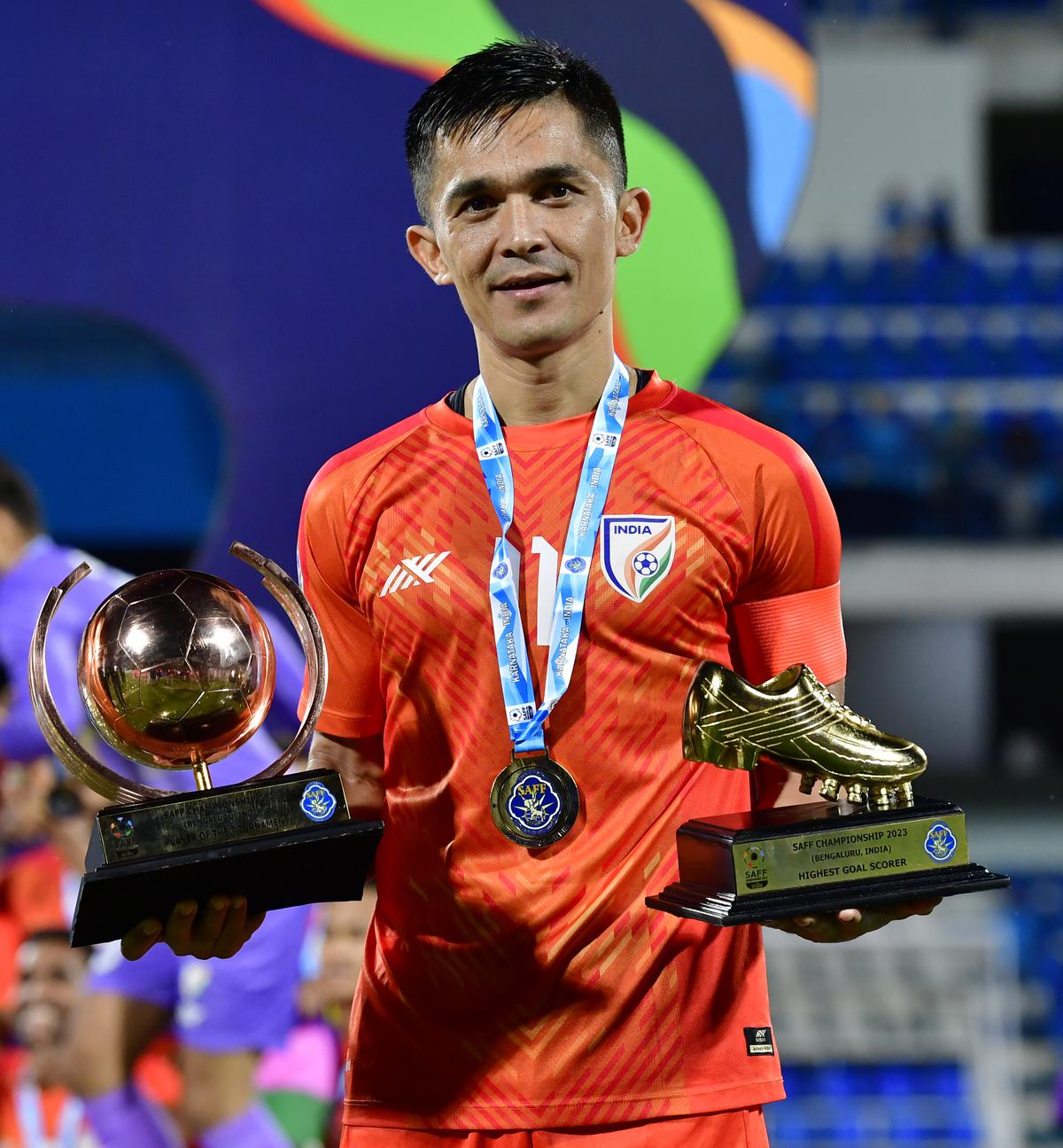 India’s Sunil Chhetri, after winning the SAFF Championship 2023, poses with the best player and highest goalscorer award.