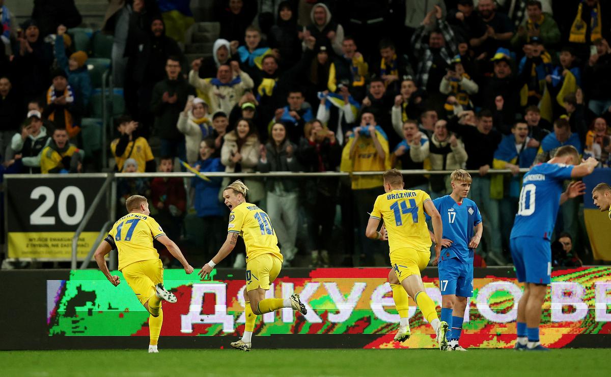 Ukraine’s Mykhailo Mudryk celebrates scoring their second goal with Oleksandr Zinchenko 