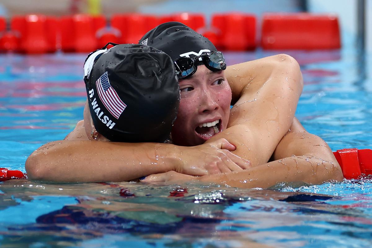 Torri Huske and Gretchen Walsh of Team United States celebrate after winning gold and silver in the Women’s 100m Butterfly Final on day two of the Olympic Games Paris 2024.