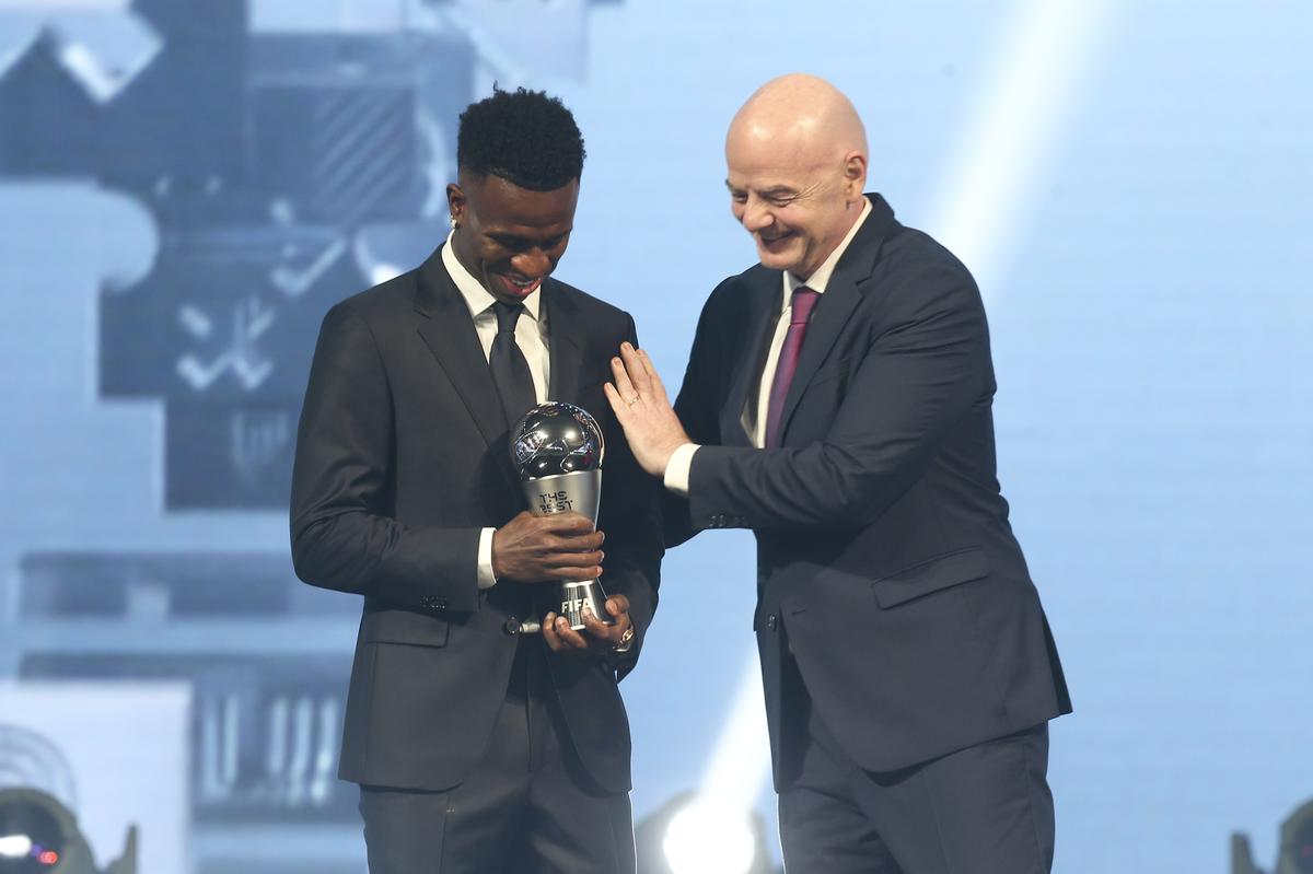 FIFA president Gianni Infantino, right, hugs Vinicius Junior of Real Madrid as he is awarded as the Best Men’s FIFA Player during the FIFA Football Awards 2024 in Doha, Qatar.