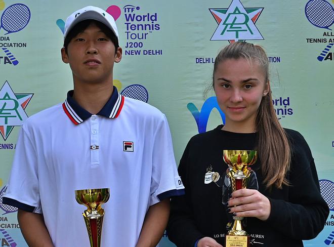 Jangjun Kim of Korea and Vlada Mincheva of Russia, the champions of the ITF junior tennis tournament in Delhi.