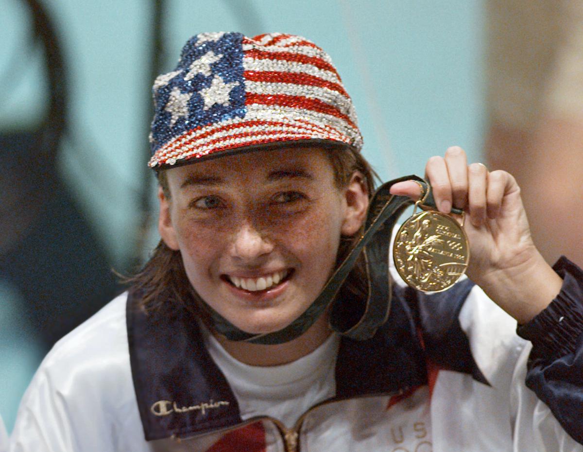 (File Photo) Olympic gold medallist Amy Van Dyken holds her medal after winning the women’s 50m freestyle at the 1996 Summer Olympic Games.