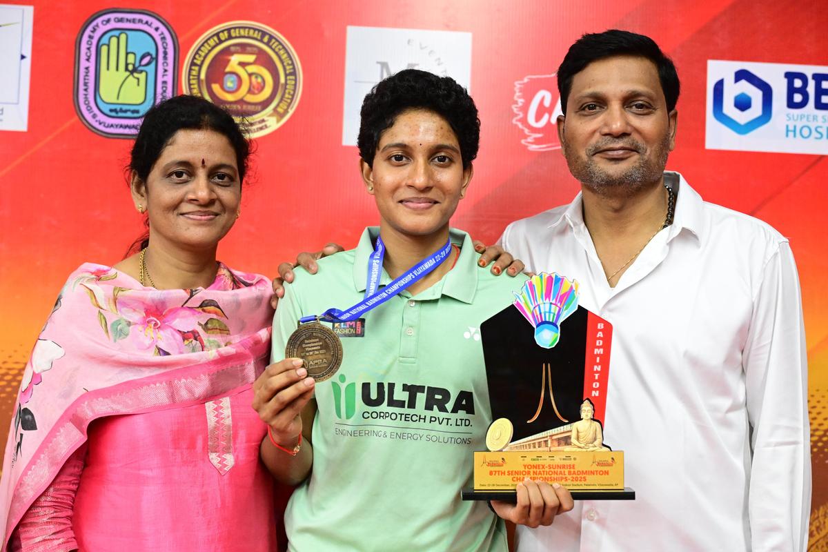 Surya Charishma Tamiri celebrates with her parents after clinching the women’s singles national title at the Senior National Badminton Championships.