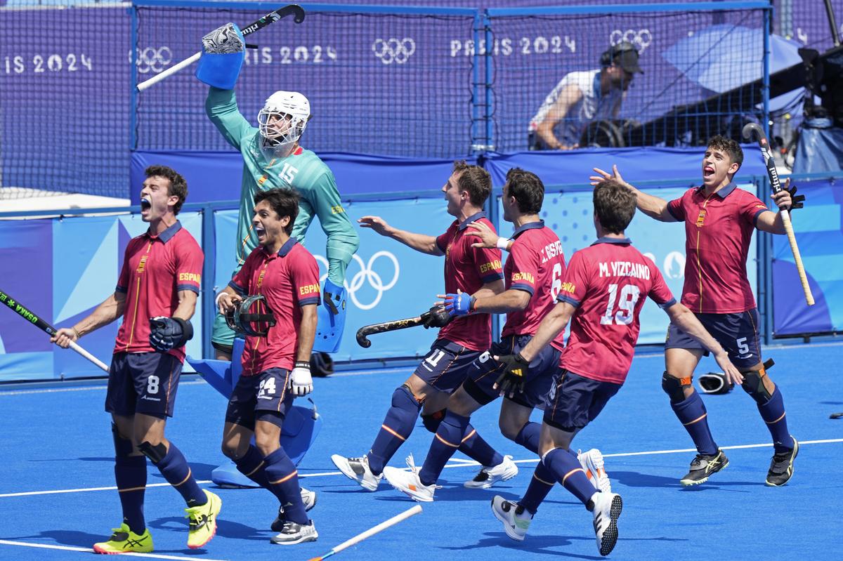 Spanish players celebrate their win against Belgium in the men’s quarterfinal field hockey match at the Yves-du-Manoir Stadium during the 2024 Summer Olympics.