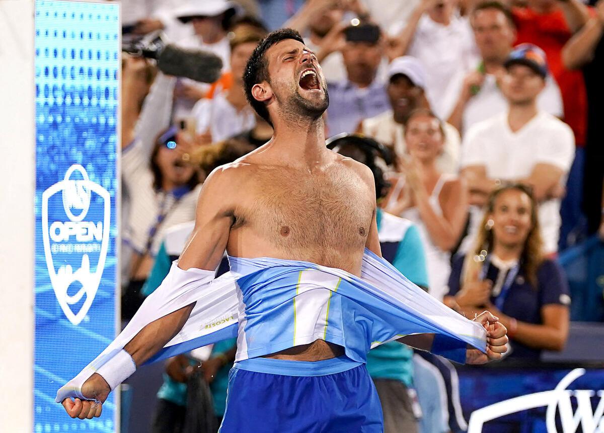 Novak Djokovic rips his shirt in celebration after defeating Carlos Alcaraz in the final of Cincinnati Open. 