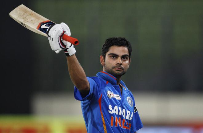 Virat Kohli acknowledges applause from the crowd as he leaves the field after scoring 183 goals against Pakistan during the Asian Cup match in Dhaka, Bangladesh on March 18, 2012. 