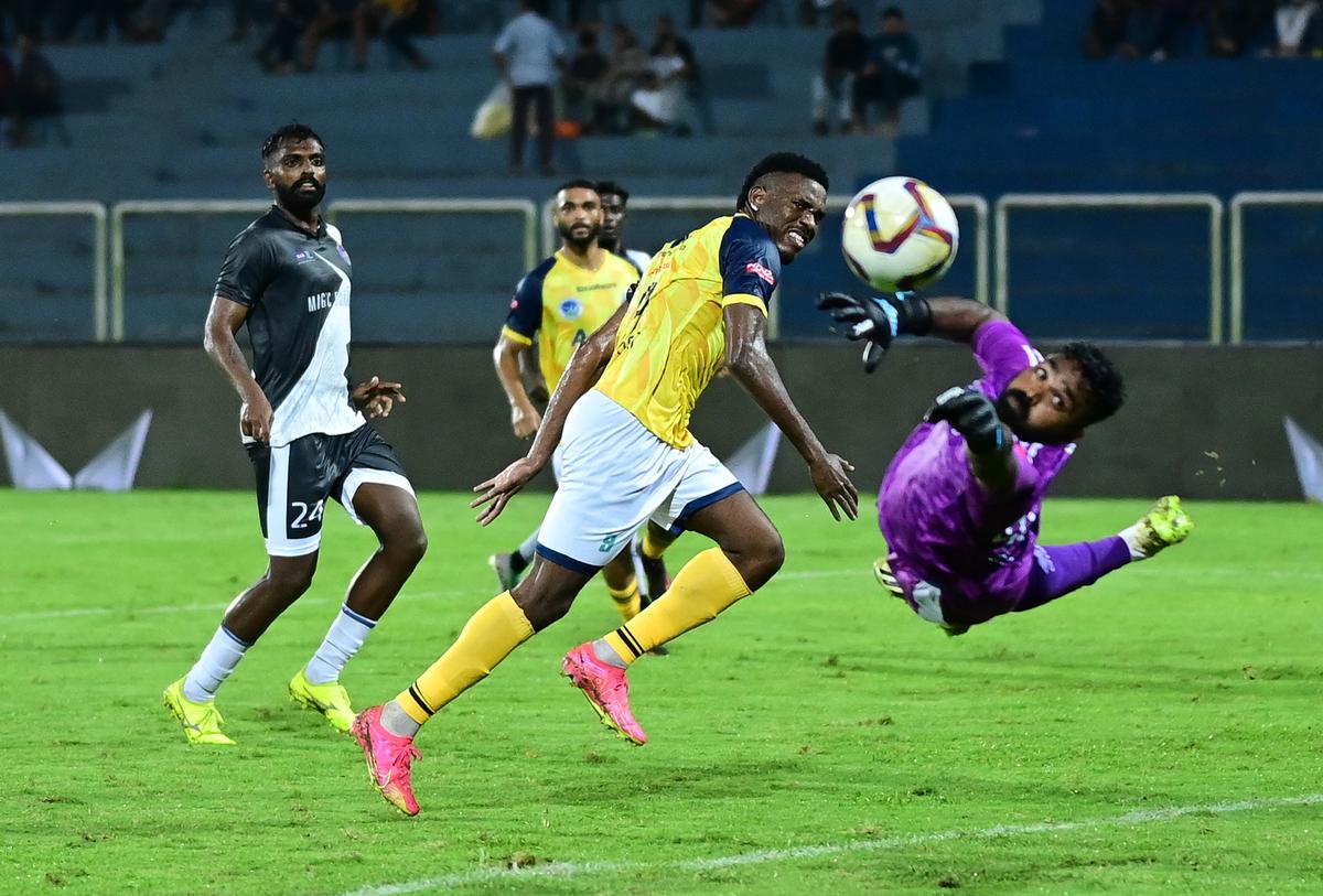 The Thrissur goalkeeper Pratheesh pulled off some stunning saves. Here he is seen going for an attempt from Calicut striker Kervens Belfort. 