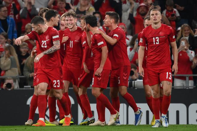 Denmark’s forward Andreas Skov Olsen (3rd L) celebrates scoring the 2-0 goal with his team-mates during the UEFA Nations League football match between Denmark and France in Copenhagen on September 25, 2022. 
