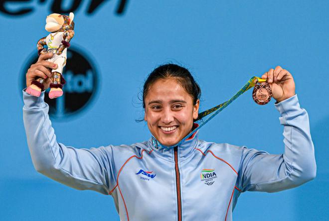 Harjinder Kaur after winning the bronze medal in the women’s 71kg category weightlifting event on Monday. 