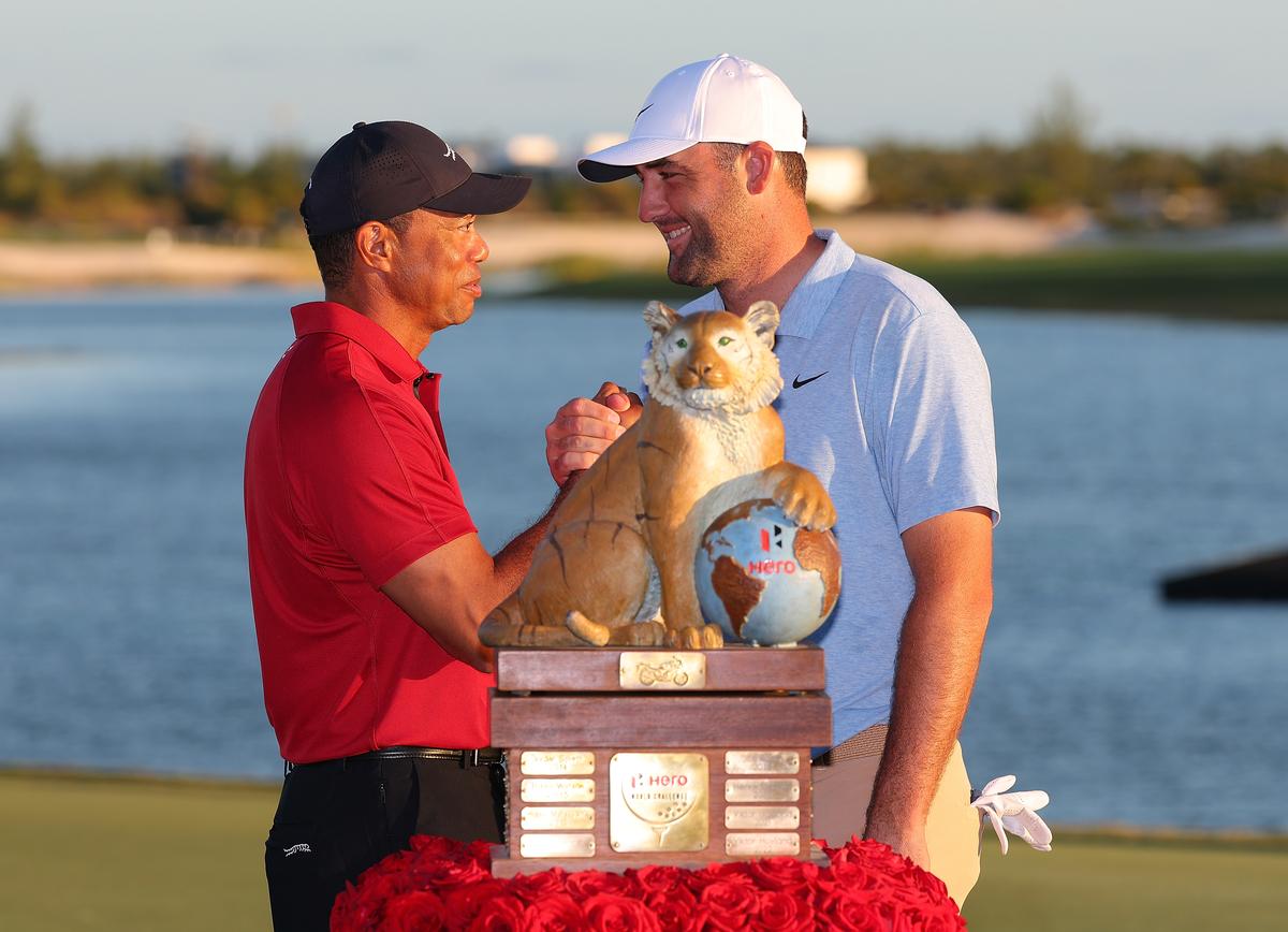 Tiger Woods of the United States congratulates Scottie Scheffler of the United States after the final round of the Hero World Challenge 2024 at Albany Golf Course on December 08, 2024.