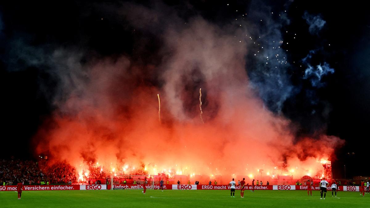 Bayern Munich fined 150,000 euros after fans disrupt German Cup game with flares, fireworks