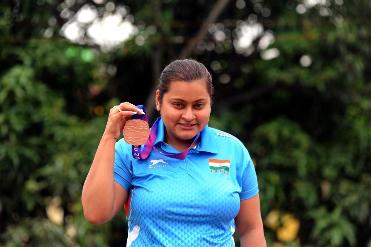 Reigning in a TT revolution: Sutirtha Mukherjee poses with her Hangzhou 2022 women’s doubles bronze medal outside her residence.