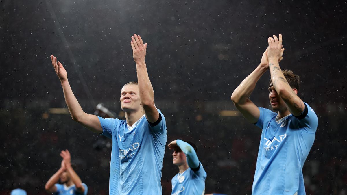 Erling Haaland of Manchester City celebrates with team after Manchester Derby brace at Old Trafford. | Photo Credit: Getty Images