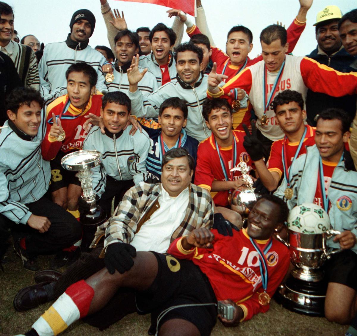 The East Bengal Team which won the Durand Cup final in New Delhi celebrates with the trophy after beating Army XI