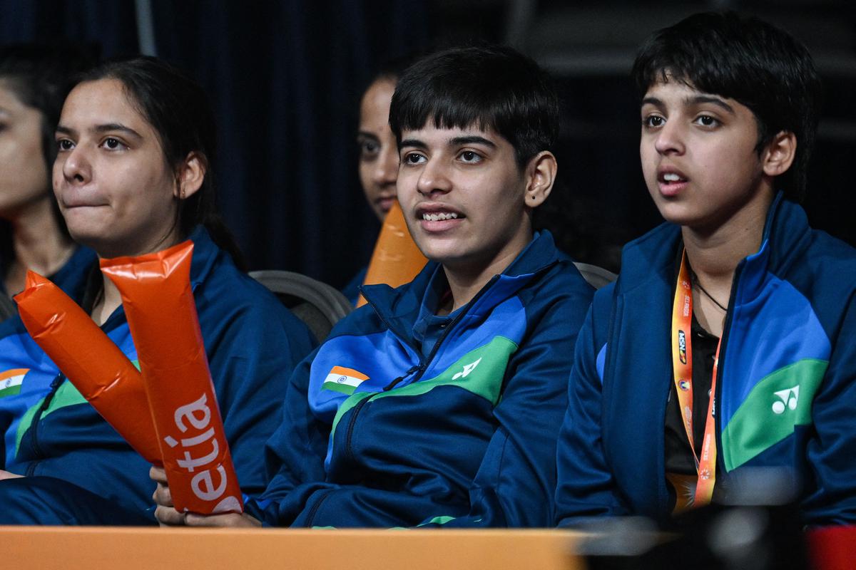 Glued to the action: India’s players from (L-R) Shruti Mishra, Anmol Kharb and Tanvi Sharma watch P. V. Sindhu play against Thailand’s Supanida Katethong at the 2024 Badminton Asia Team Championships.