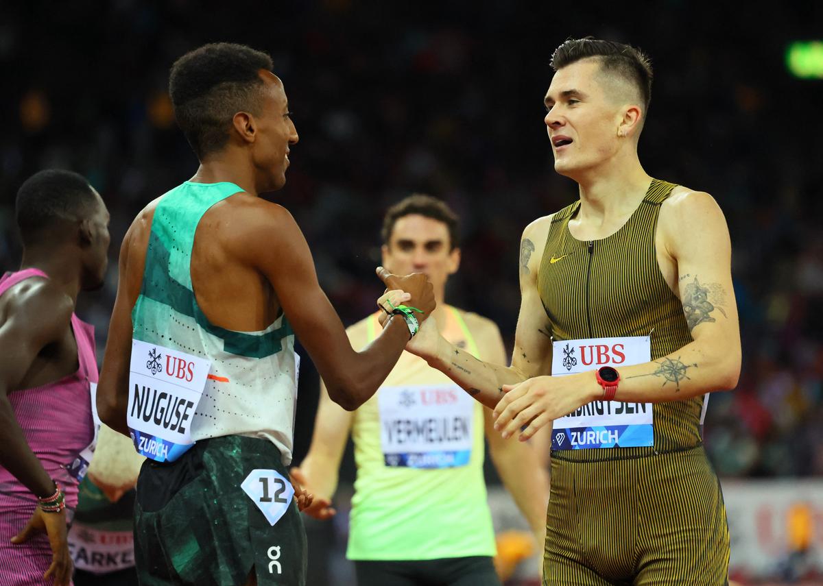 United States’ Yared Nuguse shakes hands with Norway’s Jacob Ingebrigtsen , after Nuguse won the men 1500m at the Zurich Diamond League. 