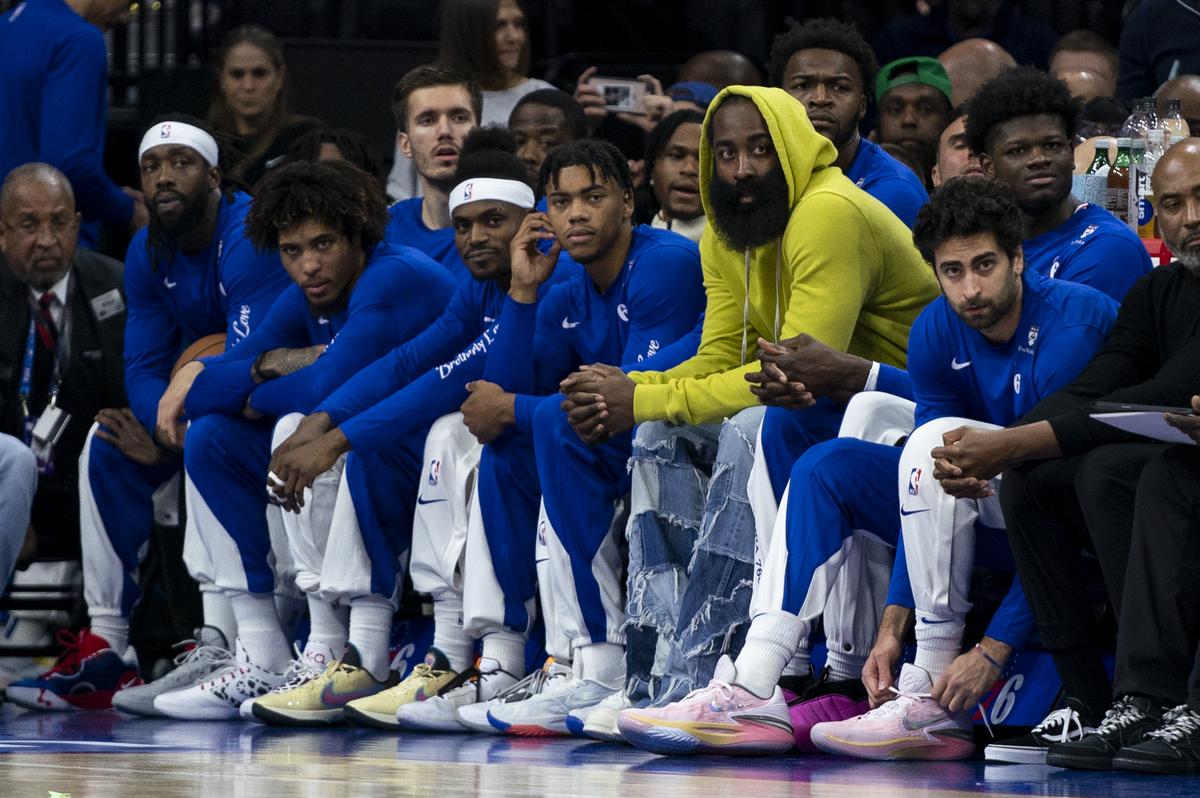 Philadelphia 76ers’ James Harden, third from right, looks on from the bench with his teammates during the first half of an NBA basketball game against the Portland Trail Blazers, Sunday, October 29, 2023, in Philadelphia. 
