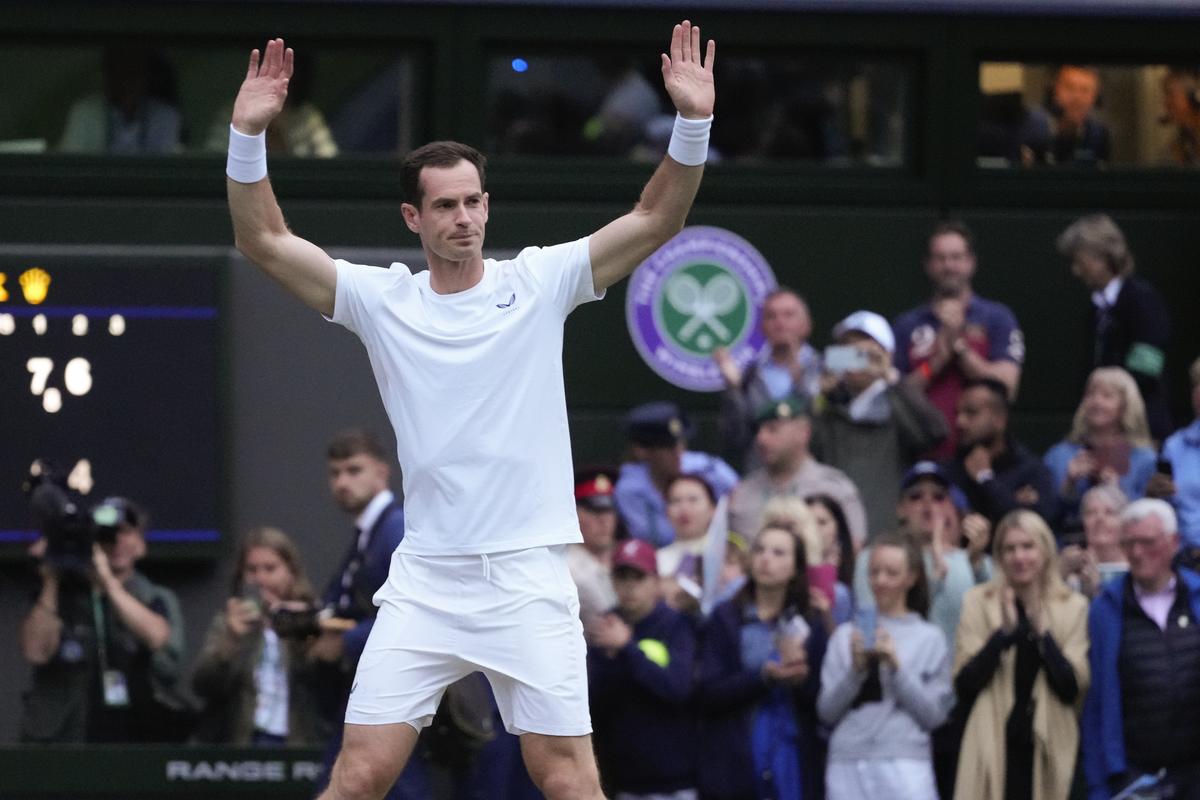 Britain’s Andy Murray waves to the Center Court crowd as he leaves following his first-round doubles loss at Wimbledon in London on July 4, 2024. 