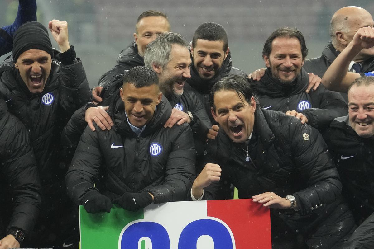 Inter Milan’s head coach Simone Inzaghi (centre right) celebrates with his teammates after winning the 20th Seria A title. 