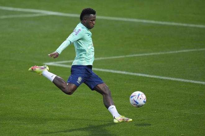Brazil’s Vinicius warms up during a training session at the Continassa sporting center, in Turin, Italy. 