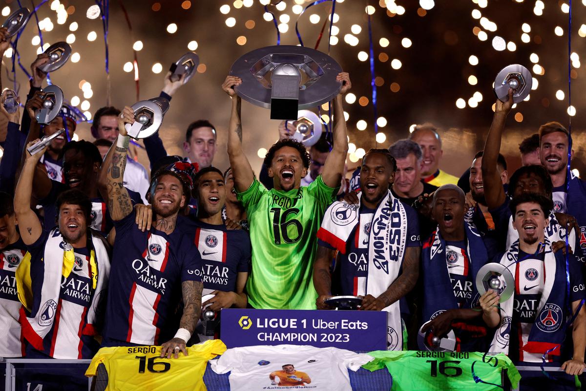 Paris St Germain’s Marquinhos and teammates celebrate winning Ligue 1.