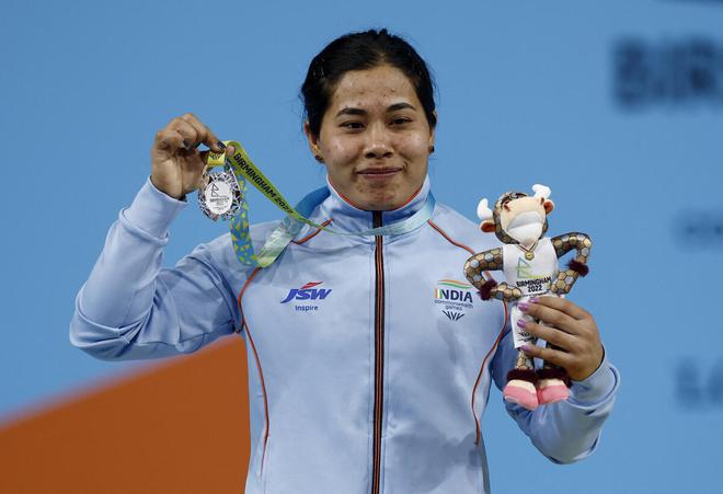 India’s Bindyarani Devi celebrates with the silver medal. 