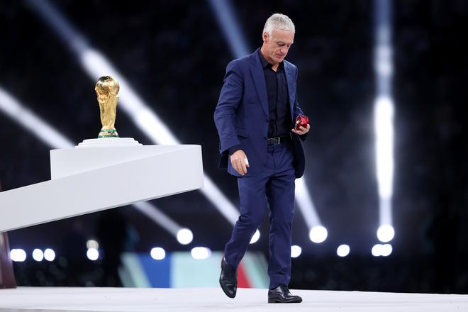 Didier Deschamps, Head Coach of France, walks past the winner’s Trophy during the award ceremony after the FIFA World Cup Qatar 2022 Final 