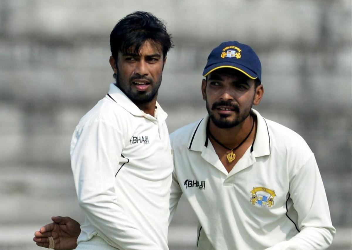 Sarbjeet Ladda (left) and Rajwinder Golu of Punjab during a Ranji Trophy cricket match against Andhra in Patiala in 2015.