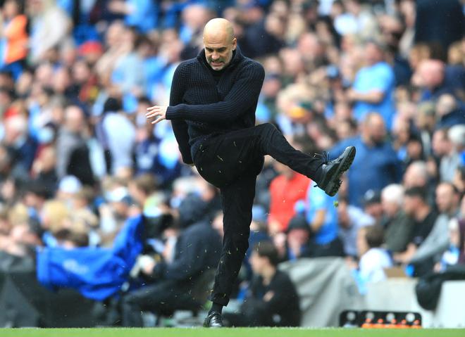 Manchester City’s Spanish manager Pep Guardiola reacts during the English Premier League football match between Manchester City and Leeds United.