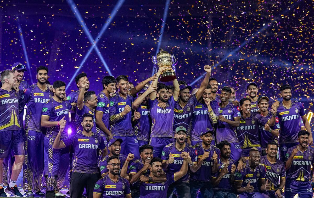 Kolkata Knight Riders players celebrate with the Indian Premier League (IPL) 2024 trophy. 