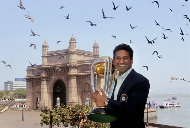 Sachin Tendulkar poses with the ODI World Cup after India’s memorable triumph at home in 2011.