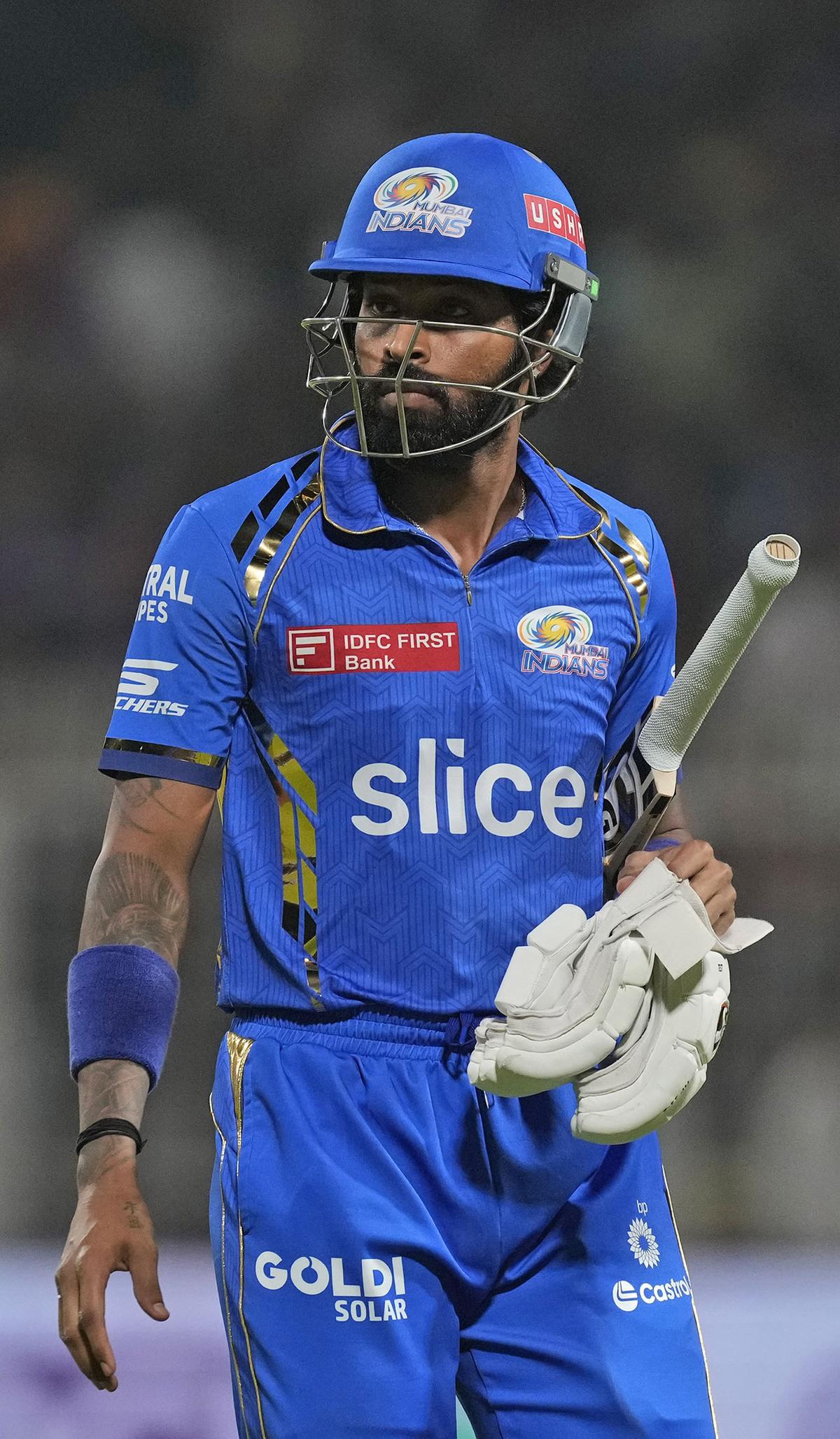 Mumbai Indians' captain Hardik Pandya walks off the field after losing his wicket during the Indian Premier League cricket match between Kolkata Knight Riders and Mumbai Indians in Kolkata, India, Saturday, May. 11, 2023. (AP Photo/Bikas Das)