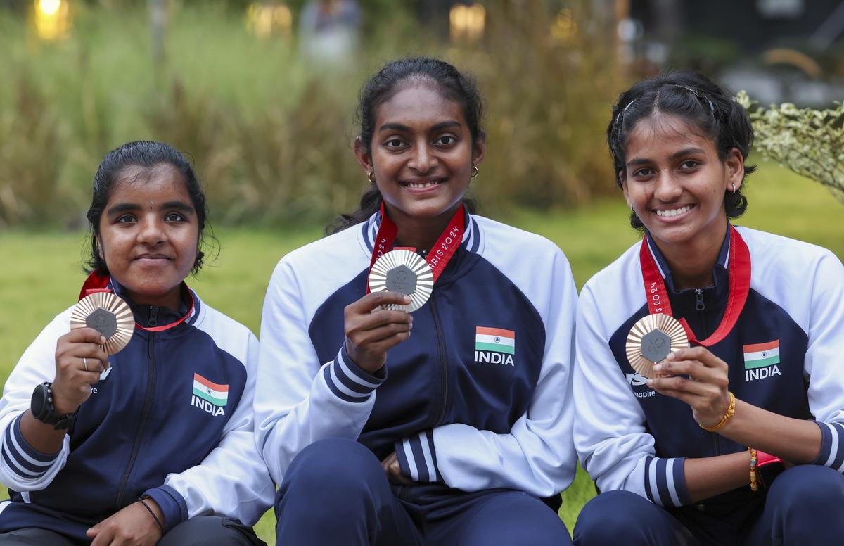 FILE PHOTO: Badminton players from Tamil Nadu and Paris 2024 Summer Paralympic Games’ silver medalist Thulasimathi Murugesan (C), bronze medalist Manisha Ramadass (R) and bronze medalist Nithya Sre Sivan pose for photos during their felicitation program, in Chennai, Thursday, Sept. 5, 2024.