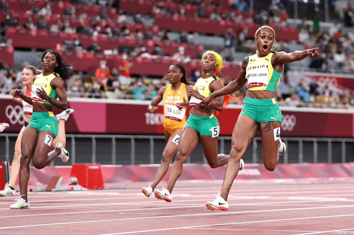 Elaine Thompson-Herah of Team Jamaica celebrates after winning the gold medal in the Women’s 100m Final on day eight of the Tokyo 2020 Olympic Games at Olympic Stadium on July 31, 2021 in Tokyo, Japan. 