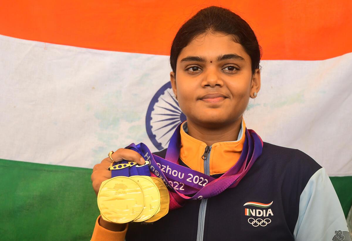 Jyothi Surekha Vennam displaying the gold medals she won in the Asian Games.