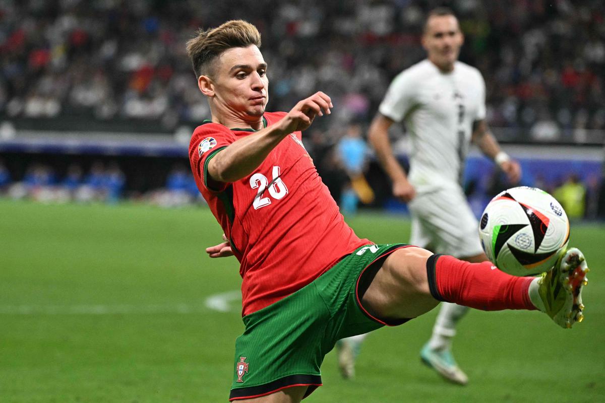 Portugal’s forward Francisco Conceicao shoots.