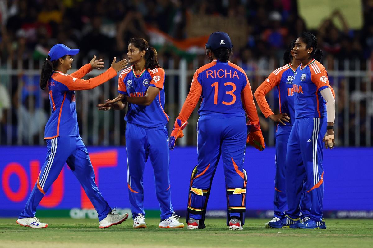 Reprieve at last: Radha Yadav of India celebrates with team mates after taking the wicket of McGrath of Australia at Sharjah Cricket Stadium.