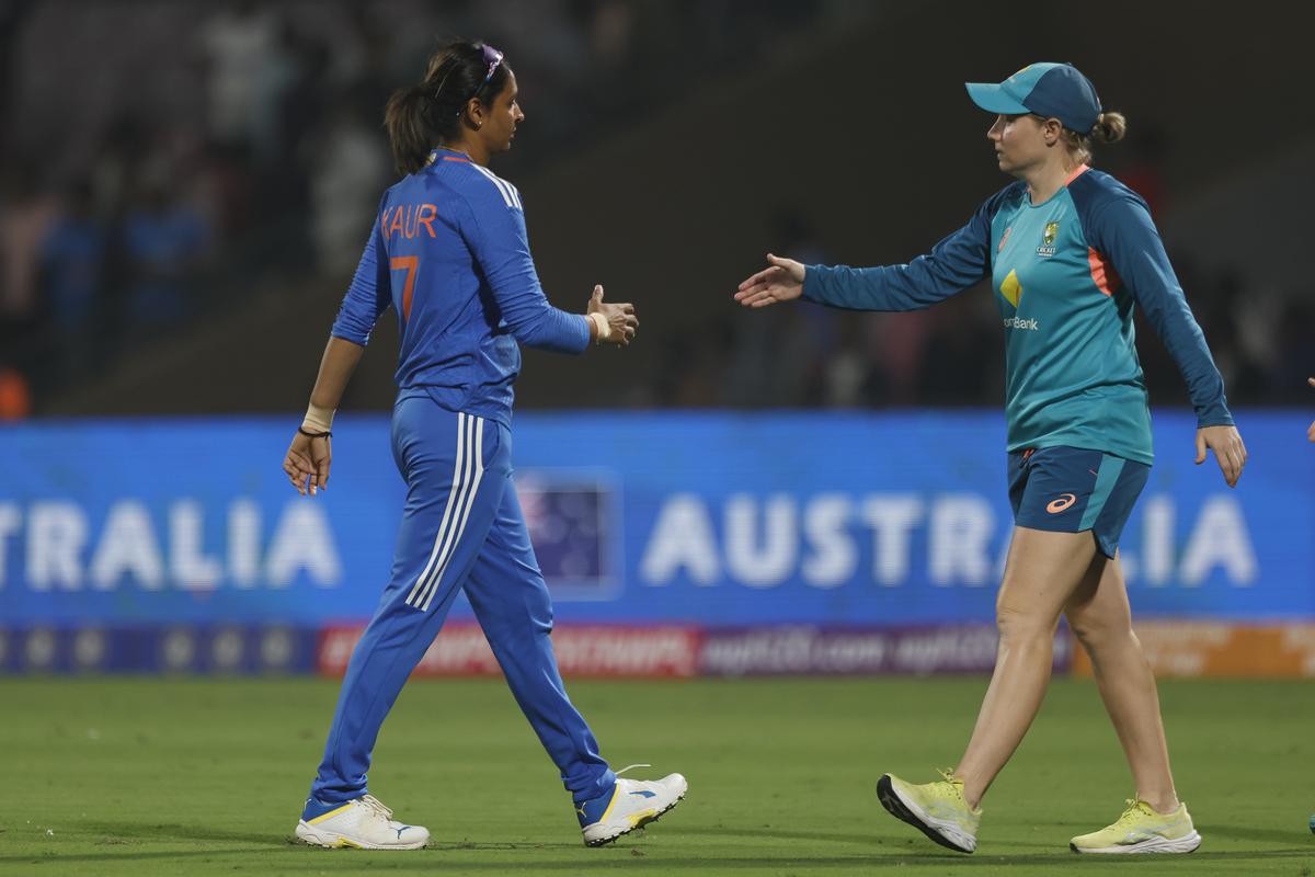 Harmanpreet Kaur (C) of India and Alyssa Healy of Australia shake hands after the match two of the women’s T20I series between India and Australia. 