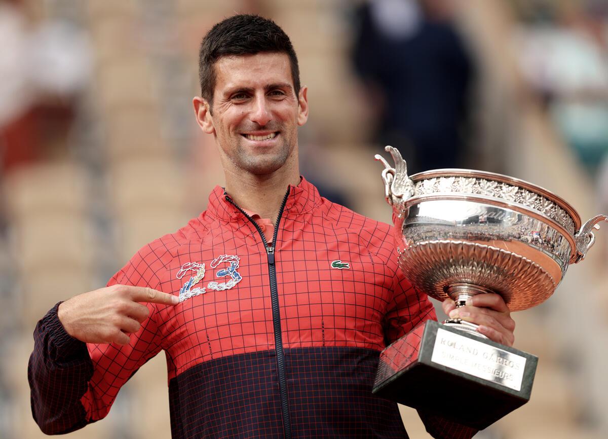 Djokovic wearing a jacket with the symbolic “23” boldly emblazoned on it.  