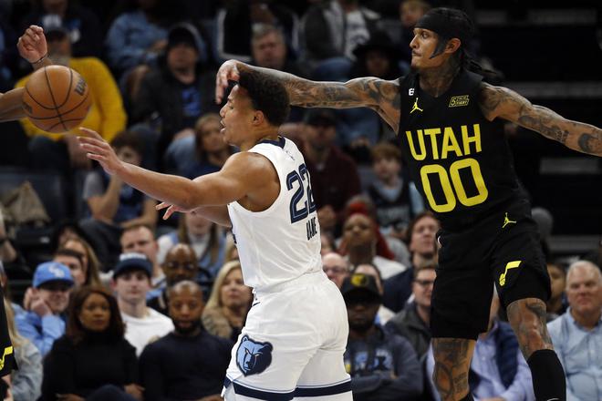 Jan 8, 2023; Memphis, Tennessee, USA; Memphis Grizzlies guard Desmond Bane (22) passes the ball as Utah Jazz guard Jordan Clarkson (00) defends during the second half at FedExForum. Mandatory Credit: Petre Thomas-USA TODAY Sports